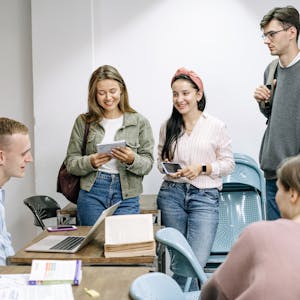 A diverse group of college students engaging in a lively study session indoors.